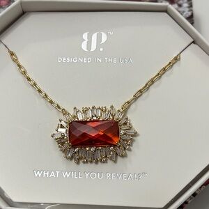 BP Gold Necklace with Vibrant Red Stone